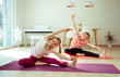© spass - Happy children making yoga at home dueing coronavirus quarantine
