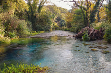 Autumn Evening. Blue Eye Nature Monument. Water Spring And Natural Phenomenon, Clear Blue Water Of River Bubbles Forth From Depth Of More Than Fifty Metres. Albania, Vlora County, Near Saranda