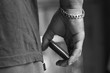 © Bill Gallery - Closeup of hand holding smartphone