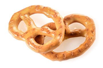 Pretzels, two mini snacks with salt for beer. Savory backed beer snack. Macro close-up isolated on white background without shadow