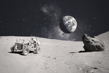 Wall Mural - astronaut on rock surface with space background. elements of this image furnished by nasa