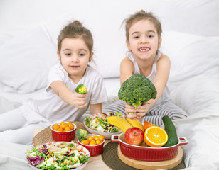 Healthy food, children eat fruits and vegetables.