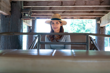 Asian woman with old carriage in Lampang province