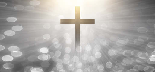 Wall Mural - The Christian cross looks bright in soft white and the glittering bokeh background is the light of hope and leads to heaven.