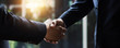 © khwanchai - successful negotiate and handshake concept, two businessman shake hand with partner to celebration partnership and teamwork, business deal