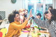 © DisobeyArt - Young work team celebrating for new startup in creative office - Happy co-workers giving strength motivation - Focus on hands - Co-working, business, technology, digital jobs and marketing concept