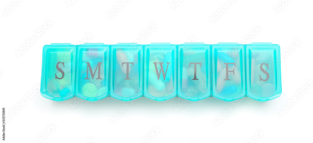 Container with pills on white background