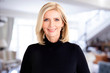 © sepy - Happy senior businesswoman portrait in the office