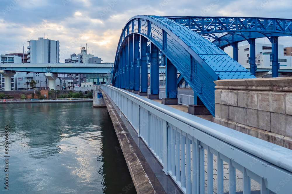 Japan. The bridge in Tokyo. Road architecture of Japan. The bridge on the background of the sky. Road bridge to the island of Odaibo. Crossing Tokyo Bay. Japan island. Landscape of the Japanese city