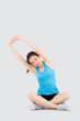 © NT_studio - Beautiful young asian woman in sport sitting stretch muscle arm workout with healthy isolated on white background, girl wear shape fit warm up and exercise and yoga for health, wellness concept.