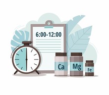 Calcium, Magnesium, Iron And Alarm Clock. Time Of Pill. Health Care, Pharmacy, Medicine Concept. 