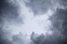 Low Angle View Of A Dark Cloudy Sky In The Evening - Perfect For Backgrounds And Wallpapers