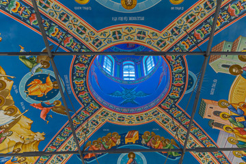 Wall Mural - Eastern сhristian orthodox сhurch of Byzantine tradition. Traditional religious paintings and colorful  traceries on the ceiling.