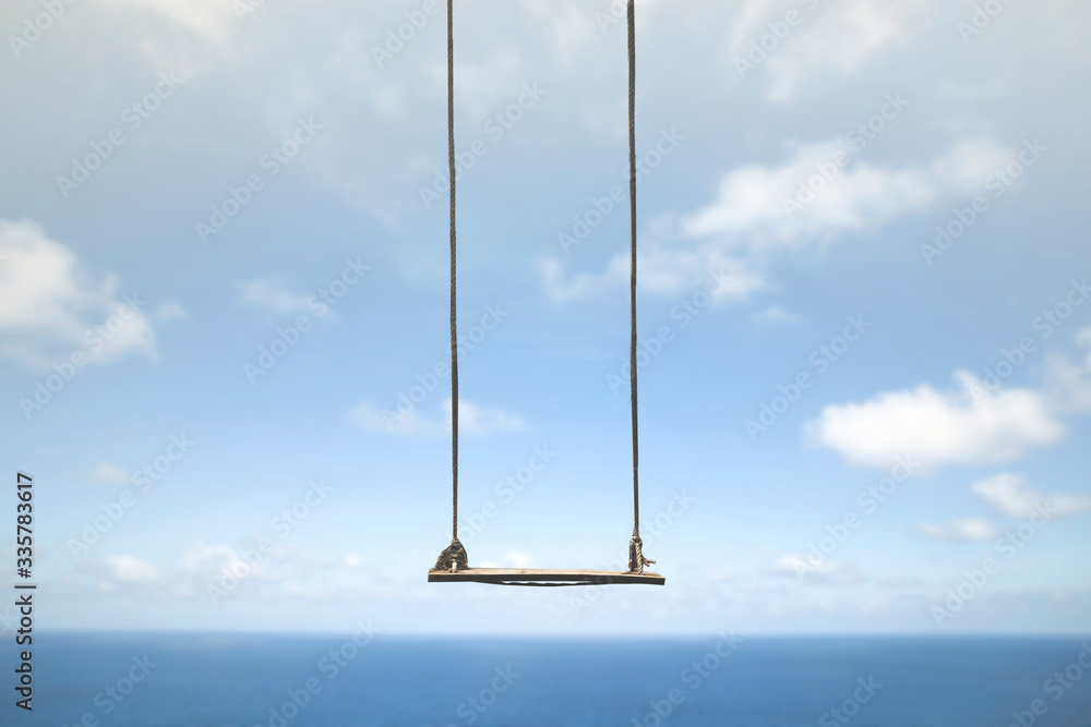 swing without anyone flies free in the sky - obrazy, fototapety, plakaty 