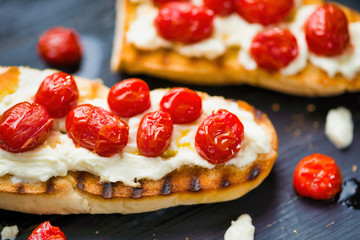 Poster - rustic italian bruschetta with caramelized cherry tomatoes and ricotta cheese