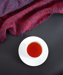 a Cup of tea on a black background. Set: white ceramic mug and saucer