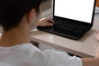 © denizbayram - Teenage student studying at home using his tablet and computer