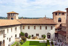 View From The Fortress Wall To The Inner Courtyard, The Corner Tower And The Tower Above The Entrance To Castelvecchio Castle In Verona, Italy.