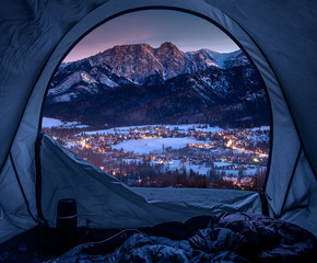 Wall Mural - View from tent to illuminated Zakopane in winter