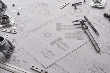 Fototapete - Engineer technician designing drawings mechanical parts engineering Engine.manufacturing factory Industry Industrial work project blueprints measuring bearings caliper tools
