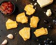 Cheese Crispies with garlic, parmesan, grape and chutney. party food snacks
