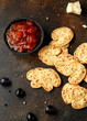 Cheese Palmiers with garlic, parmesan, grape, olives and chutney. party food snacks