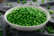 Green peas in white bowl. Healthy food