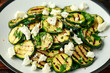 Warm salad with grilled zucchini, garlic and herbs