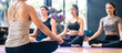 © Kawee - Group of multi ethnics people learning Yoga class in fitness club. Female Asian instructor coaching meditation pose to Caucasian and mix race students to follow correct posture for health. Banner size