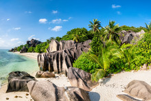 Tropical Beach With Palm Trees And Rocks On The Island Of La Digue, Seychelles, Africa