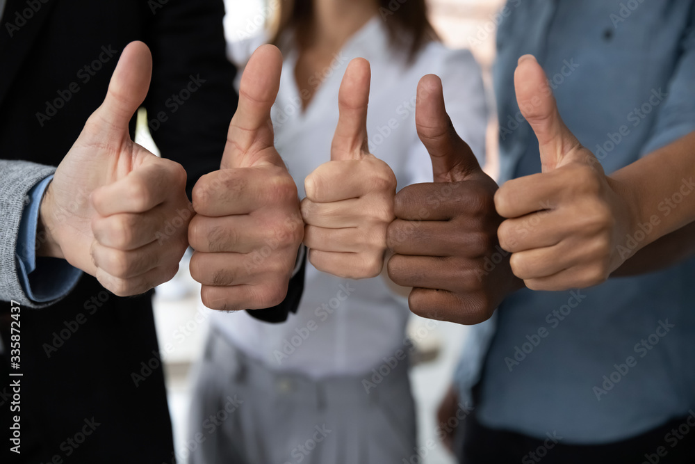 Close up view of diverse business team people hands showing thumbs up like  finger gesture recommendation or good job choice. Professional  multicultural team recommend corporate service. Stock Photo | Adobe Stock