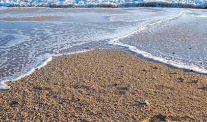 sea foam. foam on a beach