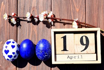 Wall Mural - Easter eggs on brown wooden background