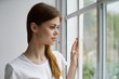 © SHOTPRIME STUDIO - young woman looking out window