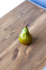 fresh ripe organic sliced pears on a rustic wooden table