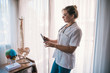 © Viviland - female doctor with artificial bones and tablet