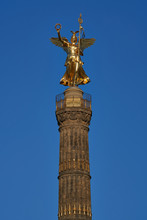 Close-up Of The Goldelse, The Statue Of St. Victoria On The Victory Column, Tiergarten, Berlin City, Germany On A Sunny Day With A Beautiful Blue Sky