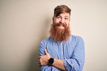 Sticker - Handsome Irish redhead business man with beard standing over isolated background happy face smiling with crossed arms looking at the camera. Positive person.