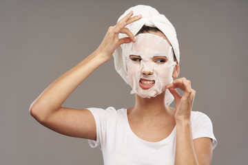 portrait of a young woman with a towel on her head