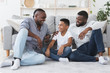 © Prostock-studio - Male Family. Grandfather, Father And Son Resting On Floor At Home