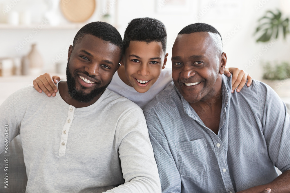 Happy black son, father and grandfather posing for family picture together - obrazy, fototapety, plakaty 