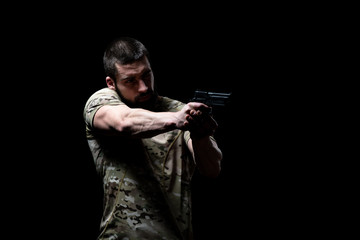 Warrior With Gun on a Black Background