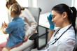 © Yakobchuk Olena - Tired female doctor with stethoscope on shoulders having rest