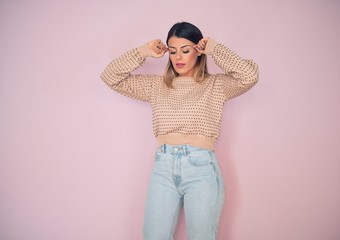 Sticker - Young beautiful woman wearing fashionable clothes standing over isolated pink background