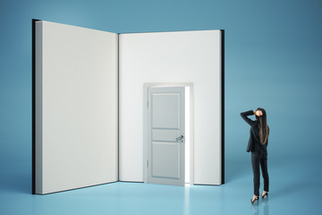 Poster - Pensive businesswoman looking at abstract open book with door