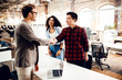 © Yakobchuk Olena - Two handsome men shaking hands in office