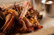 A closeup view of a pile of BBQ pulled pork.