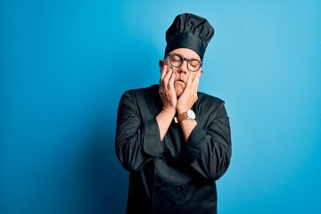 Sticker - Middle age handsome grey-haired chef man wearing cooker uniform and hat Tired hands covering face, depression and sadness, upset and irritated for problem