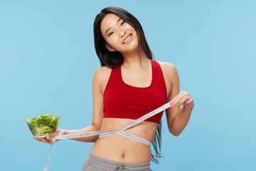 Wall Mural - young woman with salad