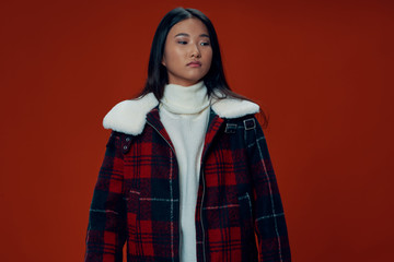 Wall Mural - young woman in a red coat